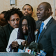 Stephon Clark’s grandmother Sequita Thompson delivers a tearful speech at a news conference in Sacramento, Calif.’s City Hall on March 26, 2018. Clark’s uncle Kurtis Gordon (left) and family attorney Benjamin Crump (right) stand with her at the podium.